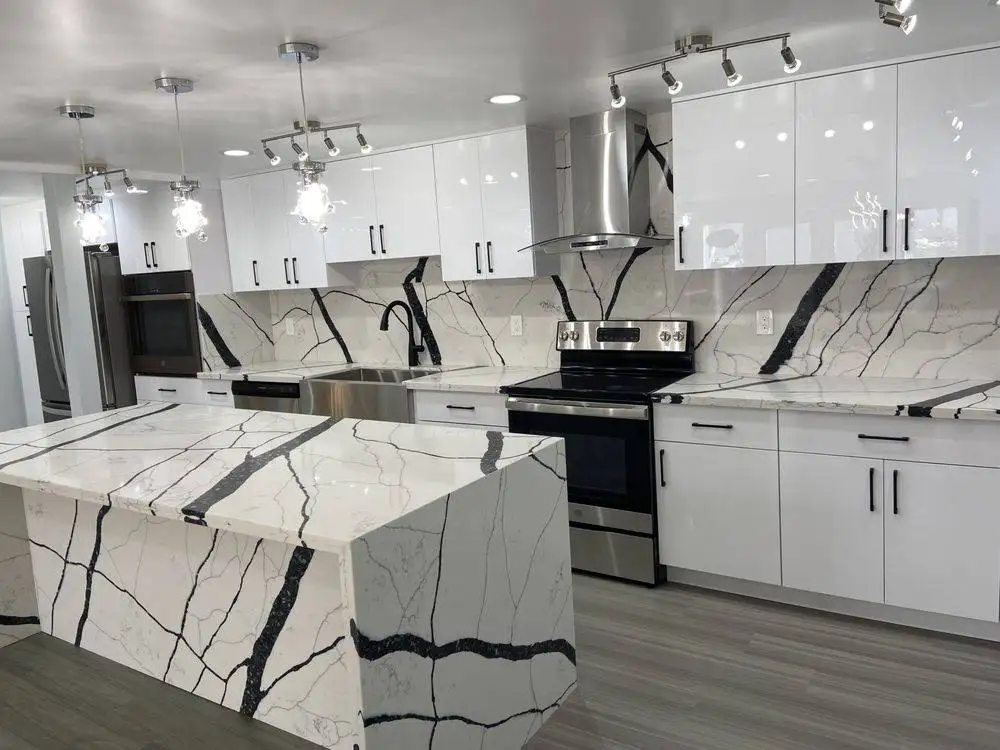 White quartz waterfall island with dramatic black veining in an Oahu kitchen